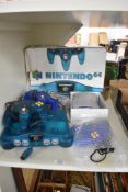 A Nintendo 64 Games Console with three Controllers and power cables along with Games Cartridges,