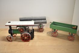 A Mamod Live Steam Tractor with Trailer and Log Trailer, burner present
