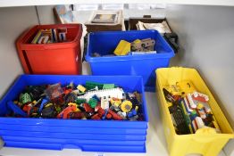 A collection of mixed vintage Lego and Accessories in three modern Lego storage boxes along with a
