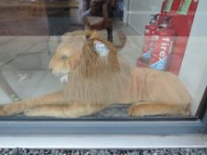 A modern Melissa & Doug Lion Soft Toy, with tag numbered WY12128, length from paw to tail 180cm