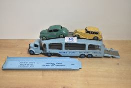 A Dinky Toys die-cast, 582 Car Transporter with 994 Loading Ramp along with two Dinky die-cast Cars,