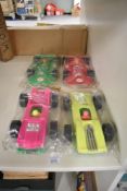 Four Marx made in Hong Kong plastic Flip it Over Racing Cars and Lightning Racer Cars, all in