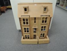 A modern wooden three storey Georgian style Dolls House with converted attic, comes with a large