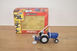 A 1984 Britains 1:32 scale die-cast and plastic model, 9516 Ford Tractor and Scrapper
