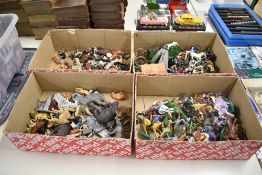 Four boxes of plastic figures including Timpo and Britains Wild West and Medieval, Britains Zoo