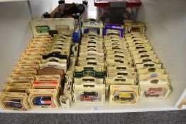 A shelf of Lledo Days Gone and similar die-casts, 80 in total, all in window display boxes