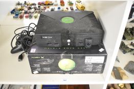 A Microsoft X-Box Video Game System, Lot No 0532, with power supply, controller and original box