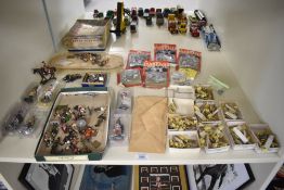 A shelf of modern figures including Valiant 1:1200 scale metal Sailing Ships, painted and