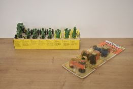 A John Deere Eight Miniature Toy Tractors die-cast set, in original box along with three Ertl die-