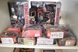 Twelve modern Hasbro Transformers, including Tribute Optimus Prime, The Last Knight Dragon Storm,
