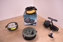 A Shakespeare Alpha fly reel in box with spare spool and 3 other vintage reels
