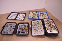 Four large pocket boxes of wet and dry fishing flies