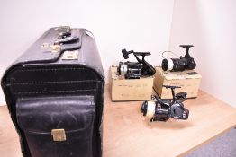 Three spinning reels in a black Gladstone style bag Two Fladen 420-060 Power surf reels in