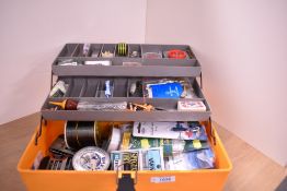 A well stocked medium sized tackle box with many items still new in packets