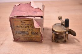 A vintage Pflueger brass 40yd raised pillar multiplying fishing reel in original box fully working