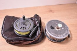 Two fly fishing reels, Shakespeare Condex 2675 and Hardy Marquis 89 in brown leather case