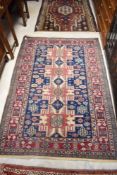A Persian rug, having blue and burgundy ground, approx. 170 x 120cm