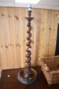 An early 20th Century and later torchere style lamp having twist column
