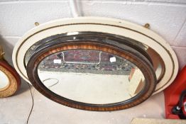 Two vintage oval wall mirrors