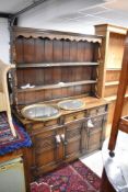 A nice quality reproduction oak dresser, width approx. 137cm