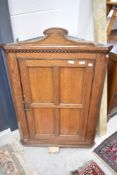 A Victorian oak corner wall cupboard, height approx. 109cm
