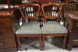 A pair of Victorian mahogany balloon back dining chairs