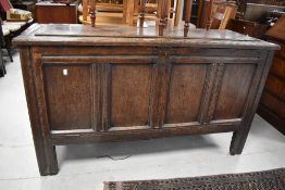 A period oak four panel kist , having drop down front conversion, width approx. 140cm