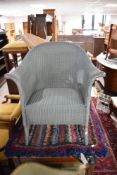 A Lloyd Loom tub chair, in green