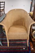 A Lloyd Loom tub chair, in beige