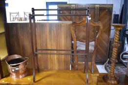 A traditional mahogany towel rail