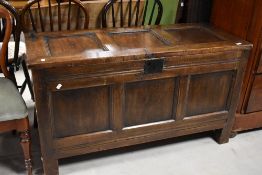 A traditional dark stained pine coffer, dimensions approx. W120 D50 H67cm