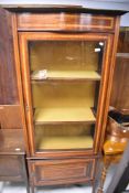 An Edwardian mahogany display cabinet, having cupboard to base, approx dimensions H180 W75 D40cm