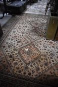 A modern carpet square having cream ground, approx. 285 x 200cm