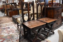 A pair of 19th Century oak hall chairs having interesting mask decoration to front