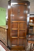 An early 20th Century oak corner hall robe