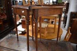 A pair of reproduction corner tables