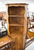 A Cryer Craft Elm corner display with cupboard under
