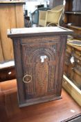 A Gothic style oak side cabinet of small proportions, approx dimensions H53 W38 D20cm