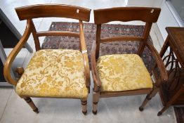 A Victorian mahogany carver chair having scroll arms and a later mahogany carver chair, both with
