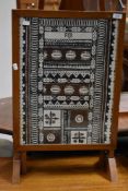 A vintage oak framed fire screen , having fabric panel, Fiji interest