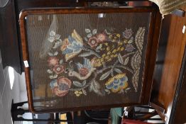 An antique tapestry firescreen