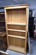 A natural pine bookshelf, approx. dimensions W96 D29 H197cm