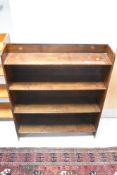 A vintage dark stained bookshelf, approx width 76cm