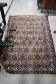 A Belgian style rug, having cream, burgundy and blue design, approx. 210 x 148cm
