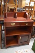 A reproduction mahogany hall cabinet and a corner wall shelf