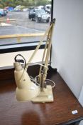 A vintage Herbert Terry angle poise lamp in cream