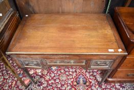 A 19th Century mahogany kneehole desk or dressing table, with inlay decoration and brass detailing ,