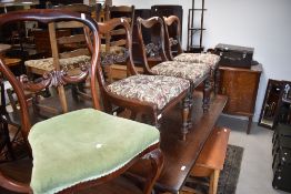 A set of three Victorian mahogany balloon back chairs and another similar