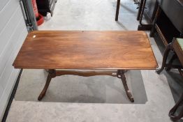 A reproduction mahogany coffee table
