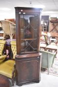 A reproduction mahogany corner display